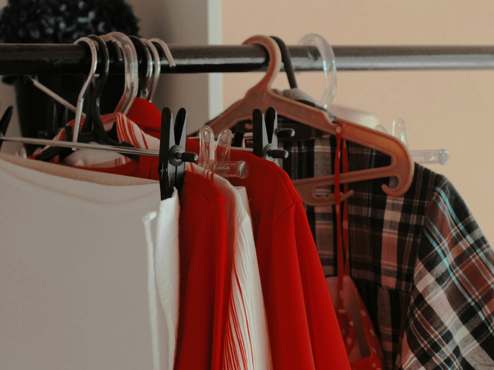 a rack of shirts hanging on a rail